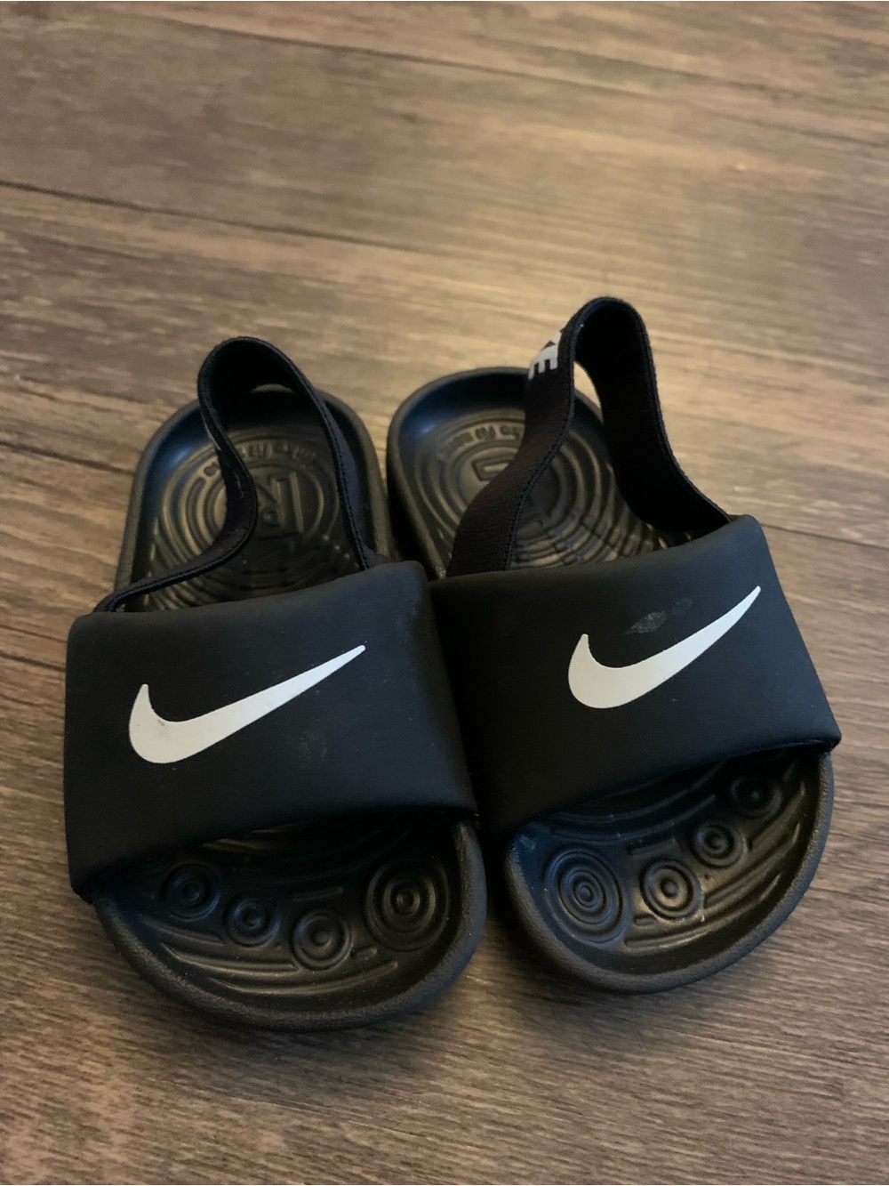 Nike Black Kids Slide Sandals with White Swoosh and Heel Strap